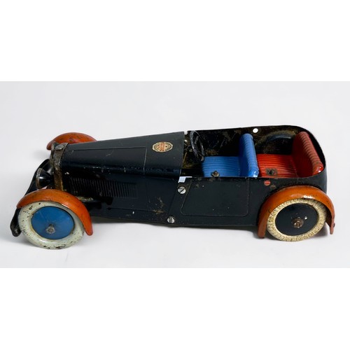 552 - A 1930s made-up Meccano tin-plate and clockwork car, white rubber wheels (one replacement), finished... 