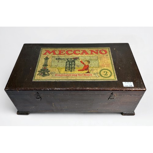 560 - An early 20th century wooden cased Meccano Engineering for Boys outfit no. 2 with removable shelves ... 