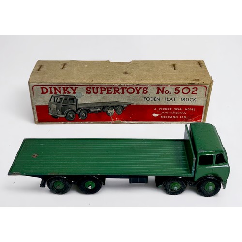 568 - A boxed Dinky Supertoys 502 Foden Flat Truck, green cab and flat truck with silver flashes, black ch... 