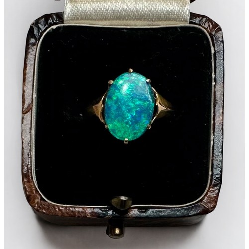 131 - A 9ct gold ring, centrally claw set with an oval opal, gross weight approximately 1.8g