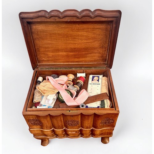 353 - A 20th century Oriental carved hardwood sewing box, with hinged top and drawers, raised on small cab... 