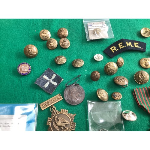 417 - A collection of military and other buttons and school attendance medals, some with the prices paid b... 