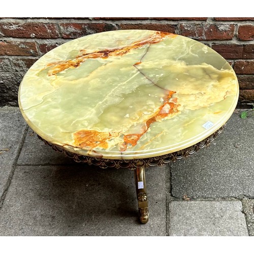 364 - A circular onyx and brass coffee table, with pierced, foliate frieze, raised on baluster brass suppo... 