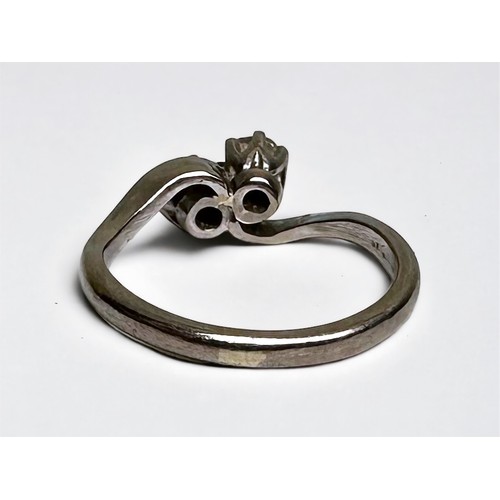 136 - WITHDRAWN: A platinum two-stone crossover ring, set with two Victorian cut diamonds, estimated total... 