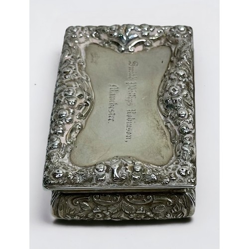 80 - An early Victorian silver snuff box by Nathaniel Mills, of rectangular form with hinged cover, the t... 