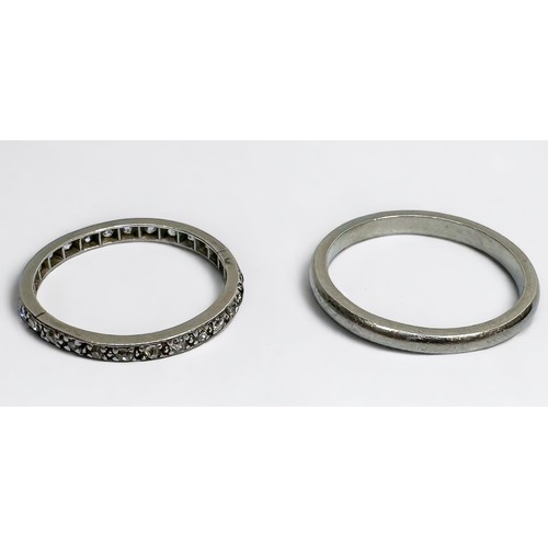 139 - A platinum wedding ring, and a white metal full eternity ring, set with small old cut diamonds, tota... 