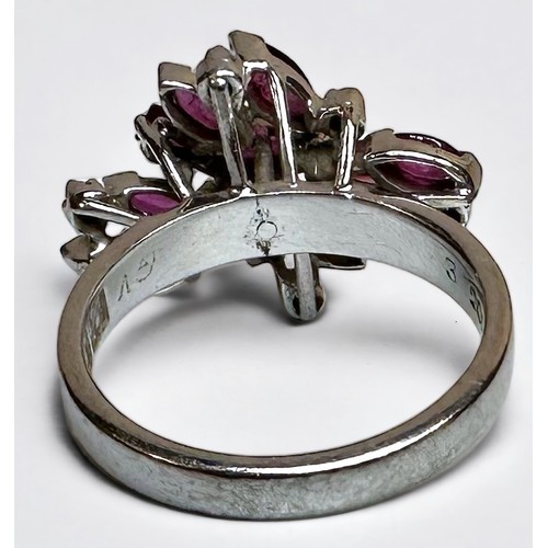 175 - An 18ct white gold dress ring, claw set with 9 x marquise-cut rubies, 2 x emerald-cut rubies, and 6 ... 