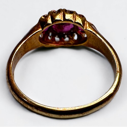 186 - An 18ct gold Victorian style, ruby and diamond ring, set with 3 x oval faceted rubies, surrounded by... 