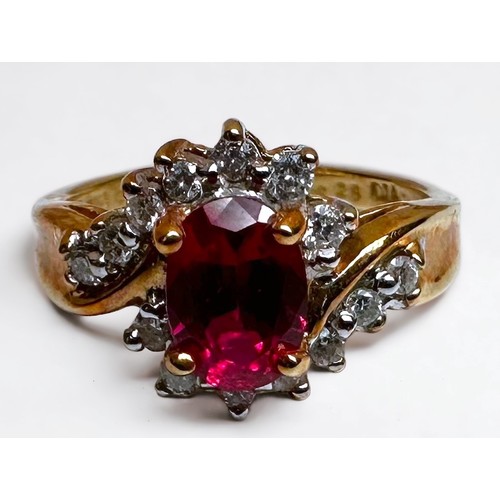 190 - An 18ct yellow gold ruby and diamond ring, set with an oval faceted ruby to the centre, (possibly la... 