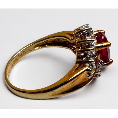 190 - An 18ct yellow gold ruby and diamond ring, set with an oval faceted ruby to the centre, (possibly la... 