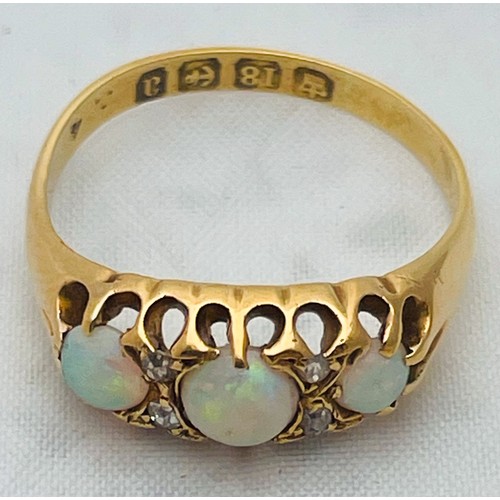 221 - An 18ct yellow gold opal and diamond ring, set with three round opals, and 4 x small diamonds, hallm... 