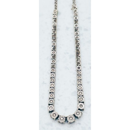 225 - A 9ct white gold necklace, illusion set with small diamonds, weighs 13.5 grams.