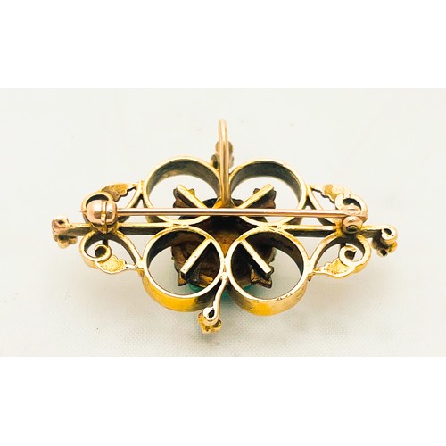 210 - A 14ct yellow gold brooch in a foliage design, set with 19 x cabouchon green turquoise to the centre... 