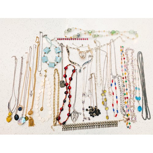 215 - A large selection of costume jewellery, approximately 130 items, including earrings, necklaces, brac... 