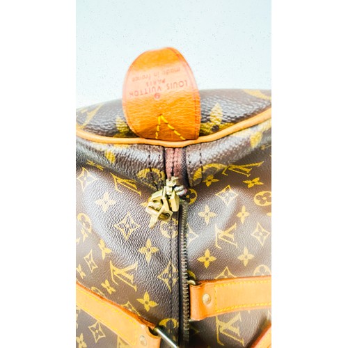 263 - A Louis Vuitton monogram holdall, 40, with tan leather luggage tag, brass hardware, zip broken.