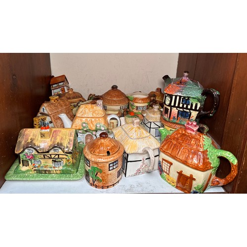 38 - Thirty-three various Cottageware ceramic teapots, jugs, butter dish and biscuit barrels, comprising,... 