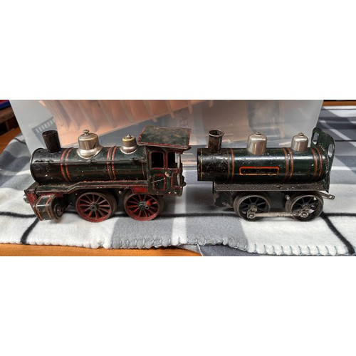 727 - A collection of assorted tinplate ‘O’ gauge railway including two locomotives, probably Bing and a s... 