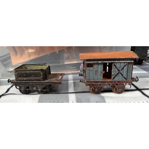 727 - A collection of assorted tinplate ‘O’ gauge railway including two locomotives, probably Bing and a s... 