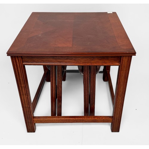 377 - A nest of three tables, the larger with two small drop-leaf tables underneath, largest measures 55cm... 