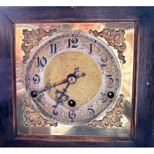 275 - A German stained oak cased bracket clock, the brass dial with silvered chapter ring, Arabic numerals... 