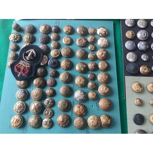 402 - A box of military badges; military, police and civilian buttons and various medallions (see last pho... 