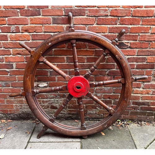 444 - A large 19th century Ships Wheel, varnished oak with central red-painted iron boss/hub and flush bra... 