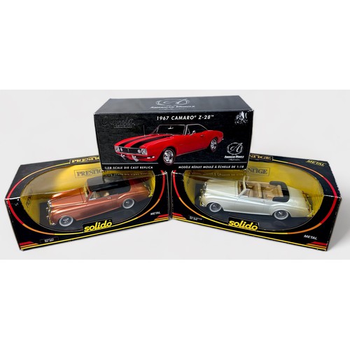 248 - A collection of seven boxed assorted die-cast 1:18 scale model vehicles, comprising, American Muscle... 