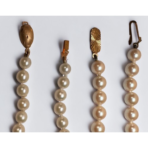 77 - Two rows of cultured pearls, 1st row is 18 inches in length, with 5.0mm white pearls, and a 9ct yell... 