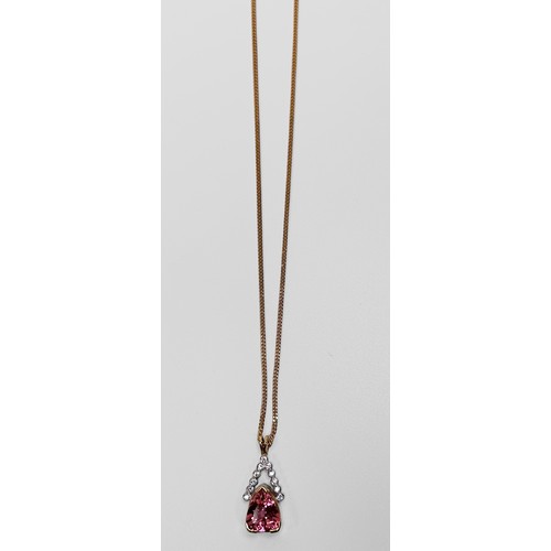 75 - A 14ct yellow gold pink topaz and diamond pendant and 18ct yellow gold curb chain, the heart shaped ... 