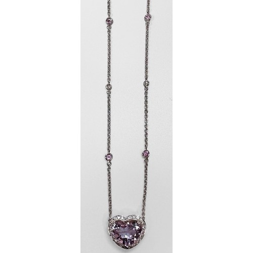 74 - An 18ct white gold necklace, claw set with a heart shaped faceted amethyst to the centre, in a diamo... 