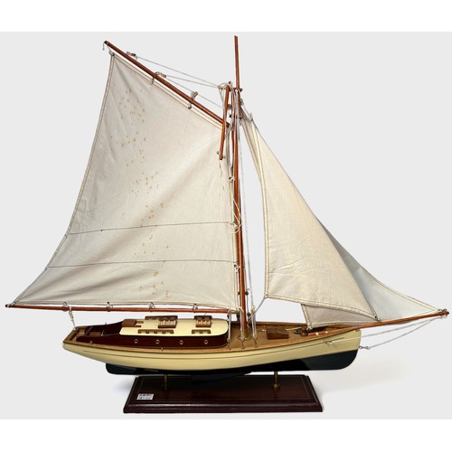 478 - A large model pond yacht on stand, with three masted sails, approx. 93cm long, together with, a Skip... 