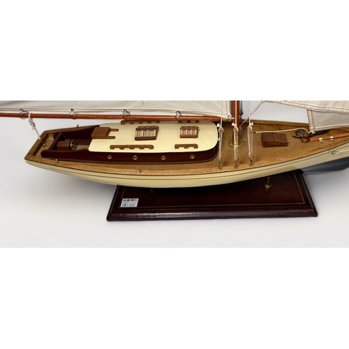 478 - A large model pond yacht on stand, with three masted sails, approx. 93cm long, together with, a Skip... 