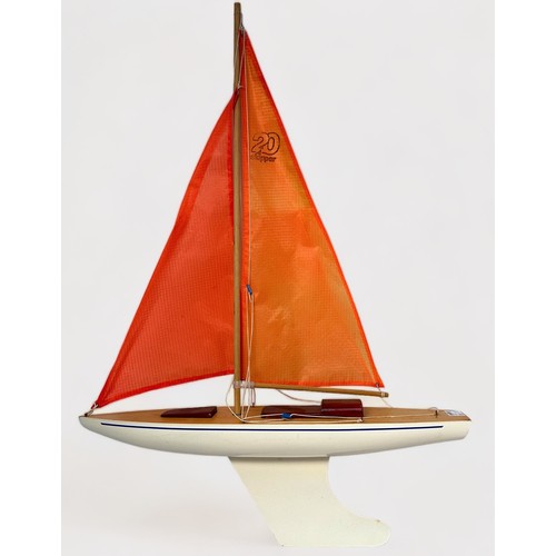 478 - A large model pond yacht on stand, with three masted sails, approx. 93cm long, together with, a Skip... 