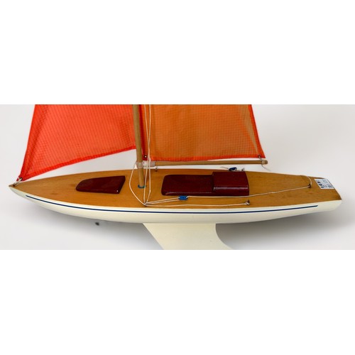 478 - A large model pond yacht on stand, with three masted sails, approx. 93cm long, together with, a Skip... 