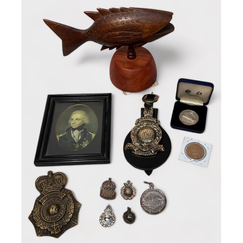 477 - A collection of assorted Militaria and collectables, including, three silver pins modelled as cap ba... 