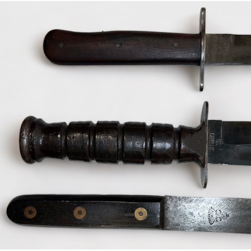 459 - A US Army 'Camillus' combat knife with non-issue leather sheath, a Luftwaffe Pilot's 'style' bootkni... 