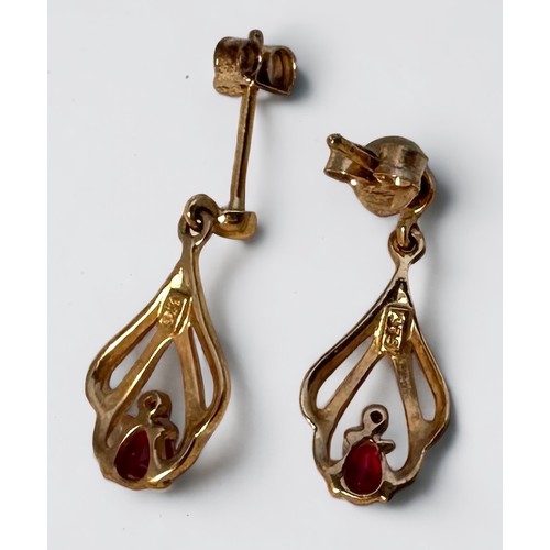 97 - A 9ct yellow gold ruby and diamond pierced pendant and chain, together with a pair of matching 9ct y... 