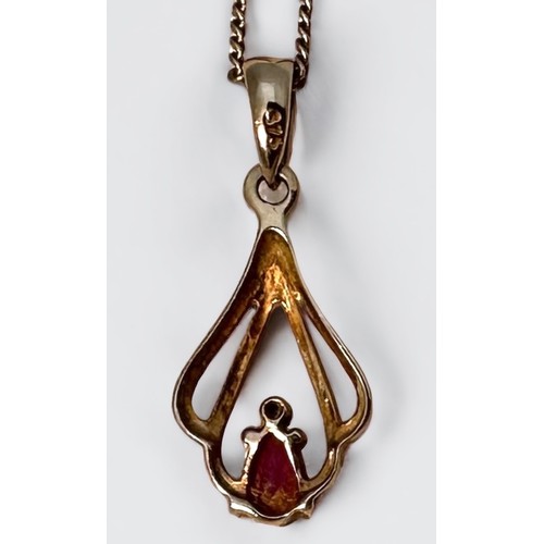 97 - A 9ct yellow gold ruby and diamond pierced pendant and chain, together with a pair of matching 9ct y... 