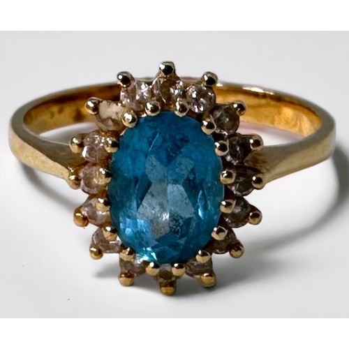 90 - An 18ct yellow gold cluster dress ring, set with an oval-shaped blue topaz to the centre, surrounded... 