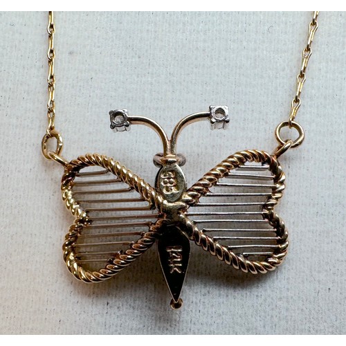 105 - A 14ct yellow and white gold butterfly pendant and chain, the butterfly is set with small diamonds t... 