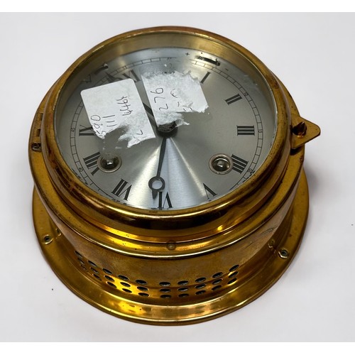 519 - A brass cased bulkhead clock by Barigo, with alarm function and silvered dial denoting hours, 15cm d... 