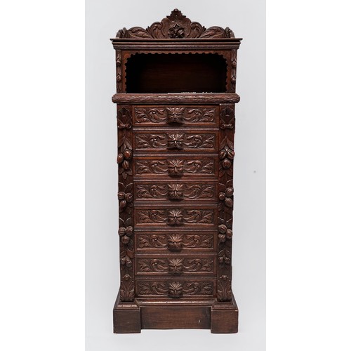 294 - An ornately carved 19th century oak Flemish chest of drawers, with carved three-quarter gallery and ... 