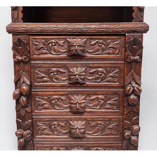 294 - An ornately carved 19th century oak Flemish chest of drawers, with carved three-quarter gallery and ... 