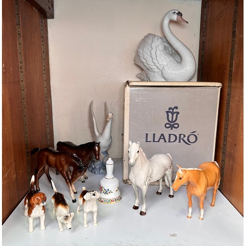 15 - A collection of various ceramic figures of animals, comprising, Lladro, Beswick, etc., to include, a... 