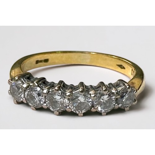 66 - An 18ct yellow gold ring, claw set with six round brilliant cut diamonds, total diamond weight 1.00c... 