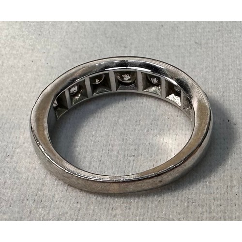 70 - An 18ct white gold half hoop eternity ring, milligrain set with 7 x round brilliant cut diamonds, to... 