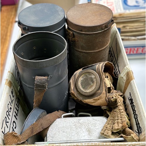 598 - Three various 20th Century gas masks, complete with cylindrical carry canisters, to include, Fernez,... 