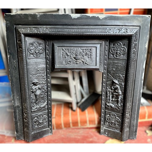 298 - A Victorian cast iron fire insert, moulded in relief with figures, 98cm tall x 99cm wide, with pine ... 