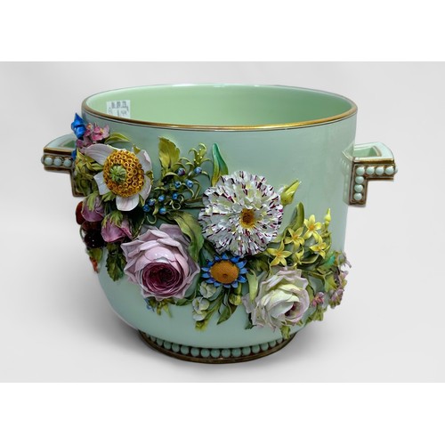 26 - A porcelain twin-handled pail, ornately encrusted with relief moulded flowers to each side, 18.5cm t... 