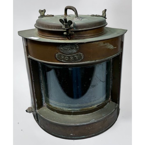 587 - A copper ship's Port side lamp, with convex glass and plaques to front, 38cm tall, together with two... 